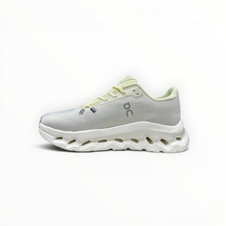 FWSports Shoes Mens On-Run Cloudtilt sneakers in light gray and yellow with a breathable mesh upper and rocker sole.