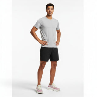 FWSports Shoes model wearing white and red On-Run Cloudtilt sneakers with mesh upper and Helion superfoam cushioning