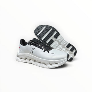 FWSports Shoes Womens On-Run Cloudtilt sneakers in white and black with mesh upper and rocker sole design