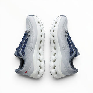 FWSports Shoes Mens On-Run Cloudtilt sneakers in white and dark blue with mesh upper and rocker sole design.