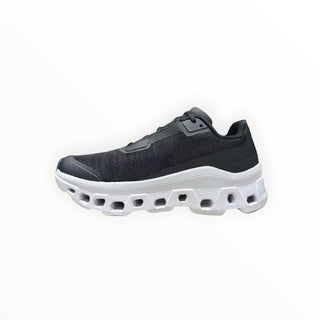 FWSports Shoes On Running Cloudmonster Void running shoe in black mesh with a thick white CloudTec cushioned sole.