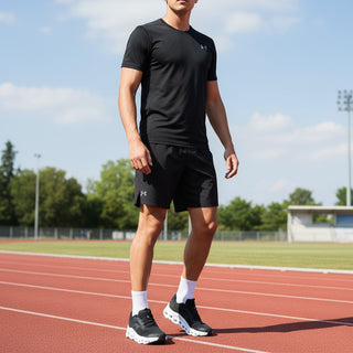 FWSports Shoes model wearing black athletic gear and On Running Cloudmonster Void sneakers on a running track