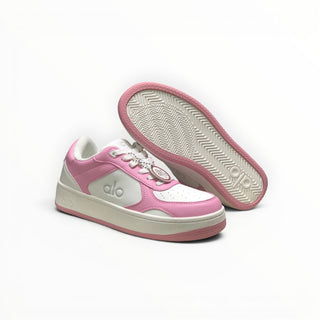 FWSports Shoes Alo Yoga Recovery Mode low-top sneakers in pink and white with a cushioned sole and lace-up design.