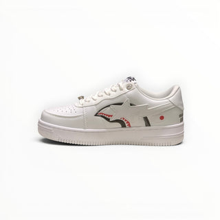 FWSports Shoes BAPE STA low-top sneakers in triple white with signature shark graphic and star side panel detail.