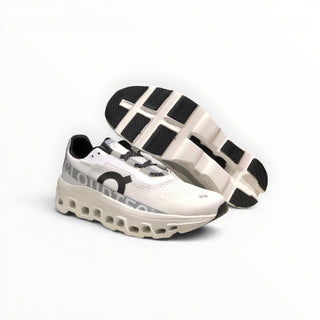 FWSports Shoes white Cloudmonster running shoes with oversized CloudTec cushioning and breathable mesh upper.
