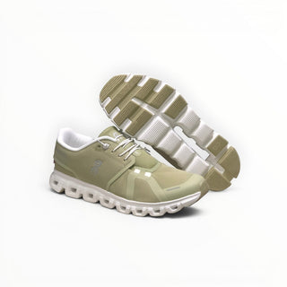 FWSports Shoes Womens On Cloud 6 Waterproof sneakers in grass green with white laces and cushioned rubber outsoles.