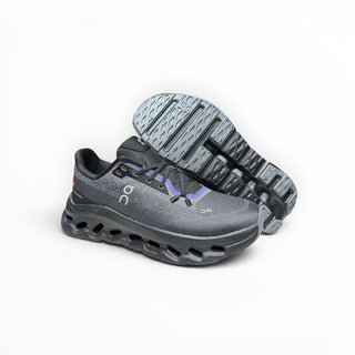 FWSports Shoes Womens On-Run Cloudtilt sneakers in black and blue with breathable mesh and cushioned rocker sole.