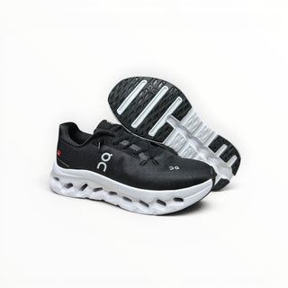 FWSports Shoes Womens On-Run Cloudtilt sneakers in black and white with mesh upper and cushioned rocker sole.