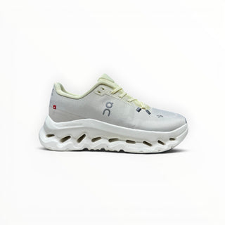 FWSports Shoes Womens On-Run Cloudtilt sneaker in light gray and yellow with a chunky rocker sole and mesh upper.
